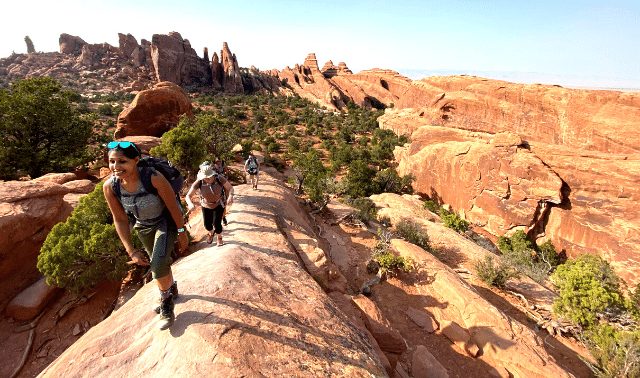Women hiking in Arches National Park.