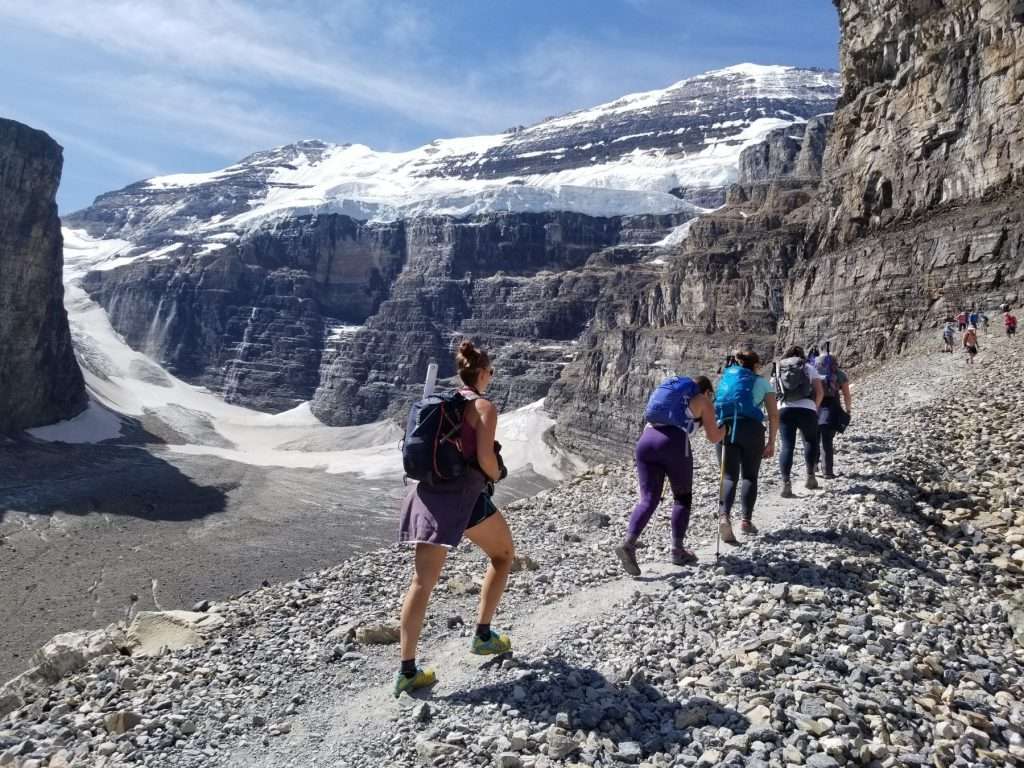 women hiking Plain of six glaciers banff national park