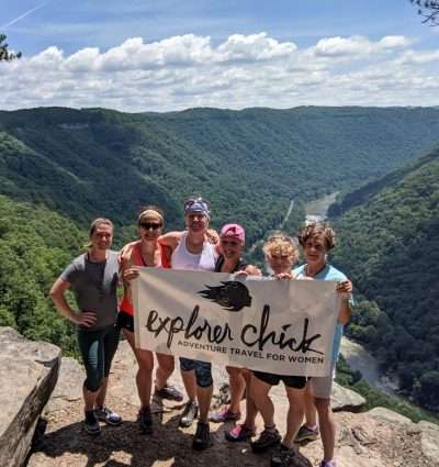 Group of women holding explorer chick banner at Virginia