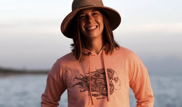 Woman wearing hat and Explorer Chick hoodie, a great gift idea for an outdoors-woman